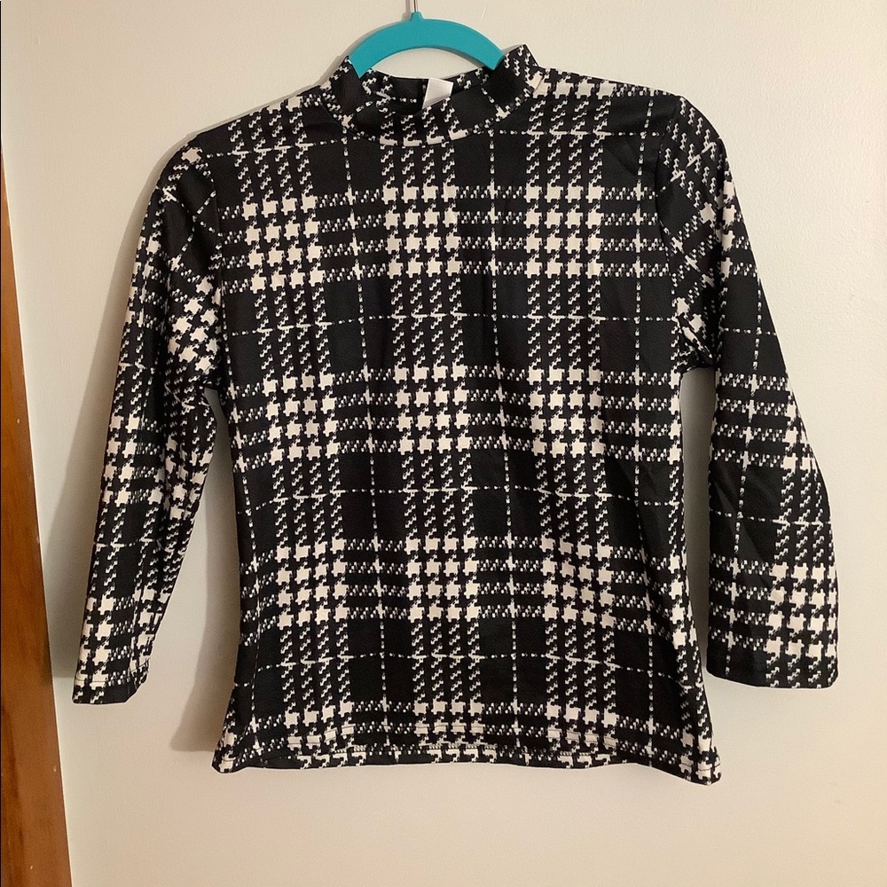 Black and white low turtle neck blouse